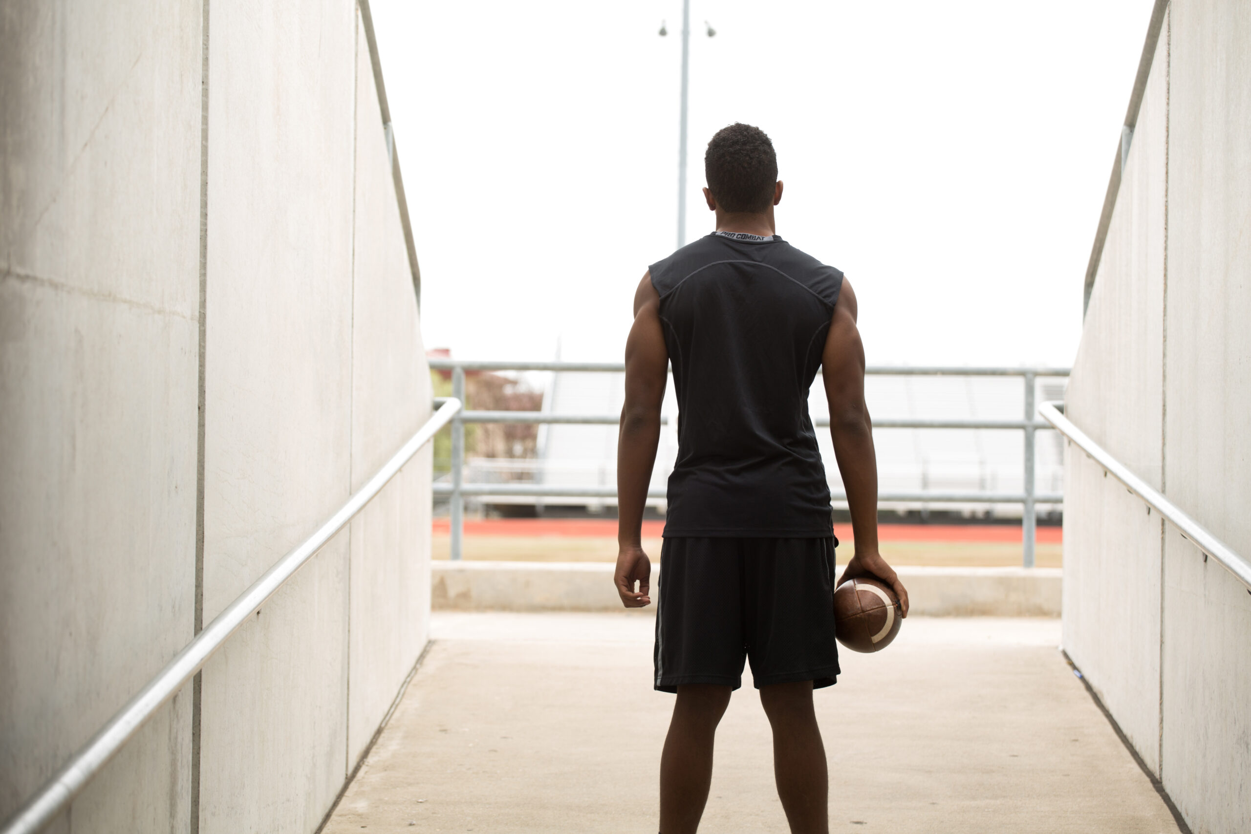 Rear view of a football player.